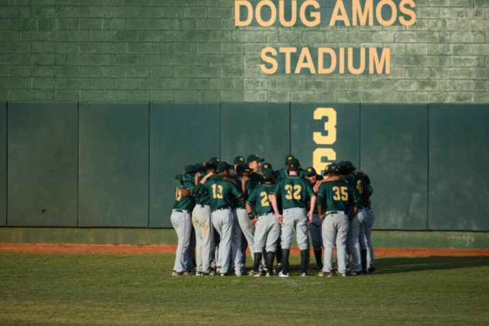baseball players huddling