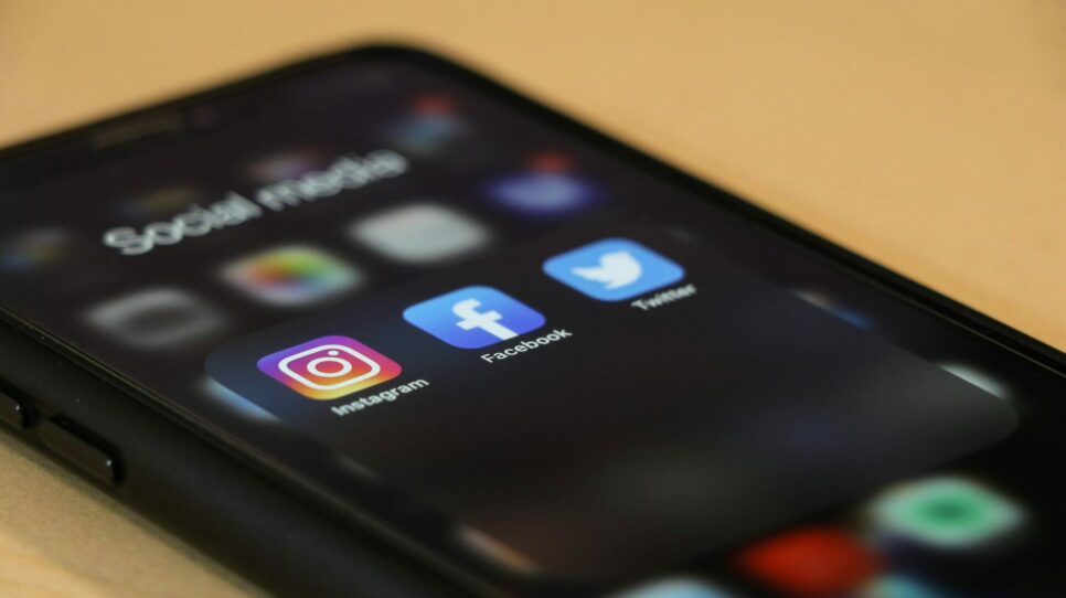 Photograph of phone with social media apps